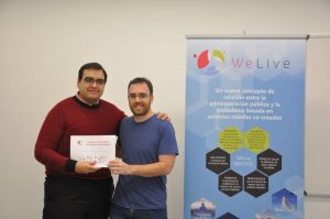 Antonio Jara, HOP Ubiquitous CEO, picking up the award from WeLive team.